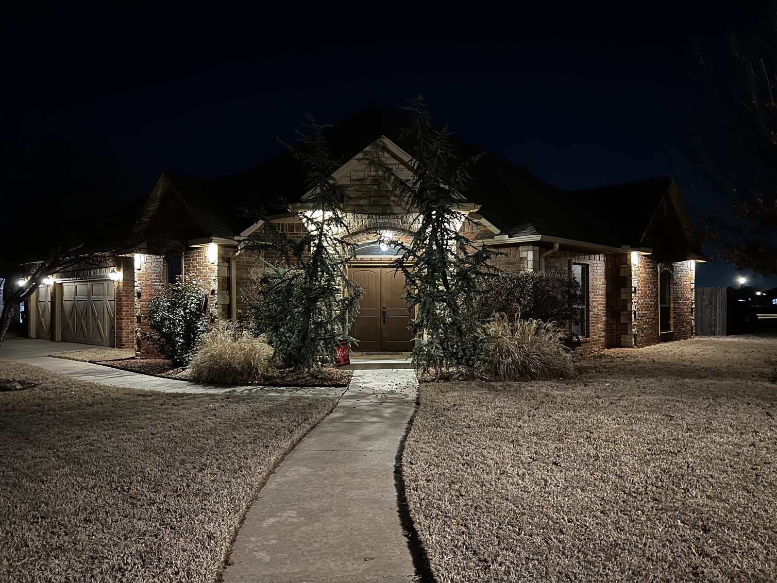 Home with professional exterior lighting installed by Jones Electric Co. in Oklahoma City